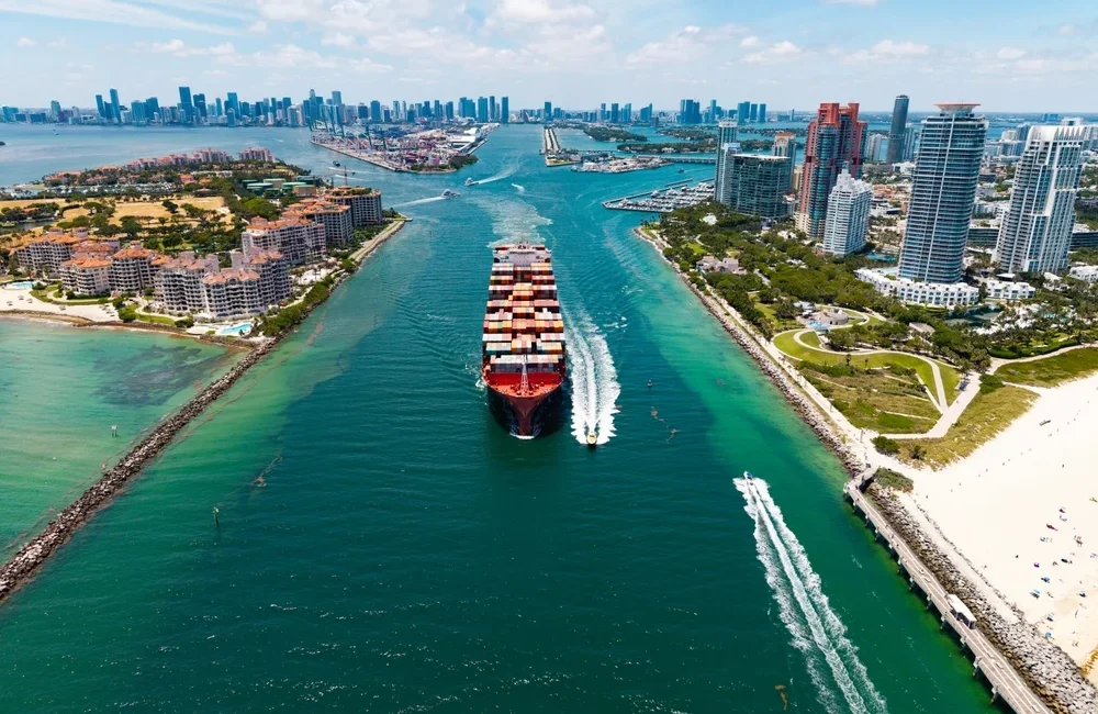 A cargo ship moving through a canal.