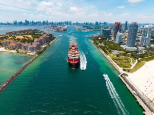 A cargo ship moving through a canal.
