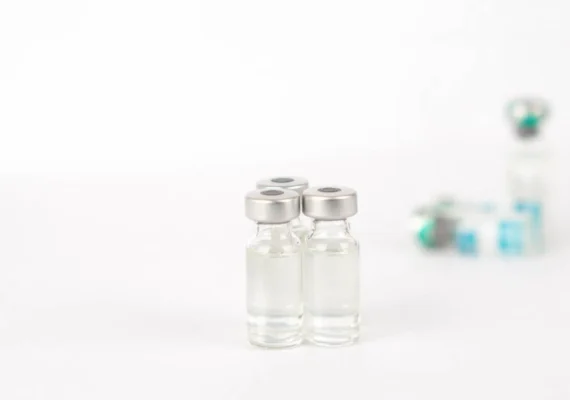 Vials containing (or that once contained) a vaccine.